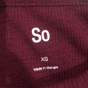 Maroon kids t-shirt with white stripes on sleeves and knot in front